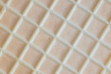 Fototapeta premium A biscuit wafer sheet with a square rough texture