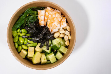 fresh food with shrimps, green beans, rice, nuts and seaweed