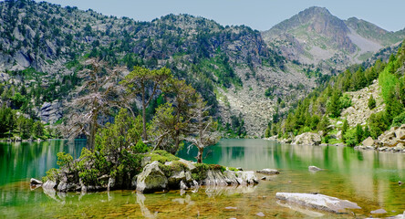 View of a lake in the Pyrenees mountains - obrazy, fototapety, plakaty