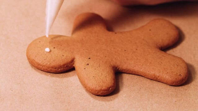 Man-shaped gingerbread cookies decorated with icing sugar. Selective focusing.