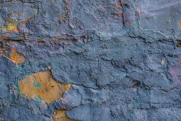 crack in the plaster walls of the old building close-up