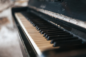 Vintage piano keys in dramatic lighting.