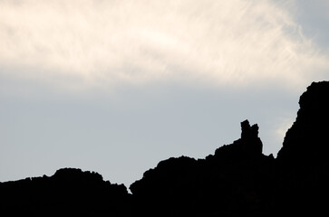 Naklejka premium Rocky profile and clouds. Teide National Park. Tenerife. Canary Islands. Spain.