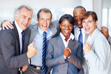 Multi ethnic business people celebrating success. Portrait of multi ethnic business people...