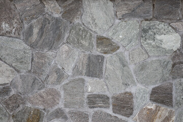Different grey stones of a wall