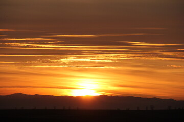 Fototapeta premium The sun sets over the horizon. Most yellow.