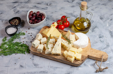 Various kind of fresh cheese. 
Set of different cheeses