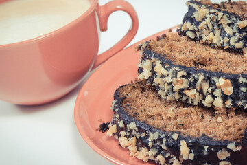 Homemade zucchini dough and cup of white coffee. Delicious dessert. White background