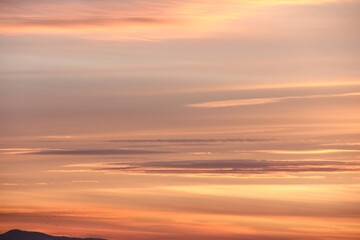 Clouds at sunset. Gradient colored arrivals in the sky.