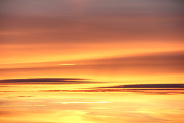 Sky and clouds at sunset. Mostly yellow.