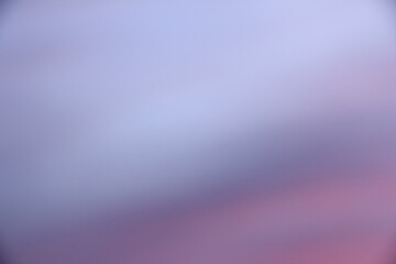 Completely blurred background. Colors blue and pink.