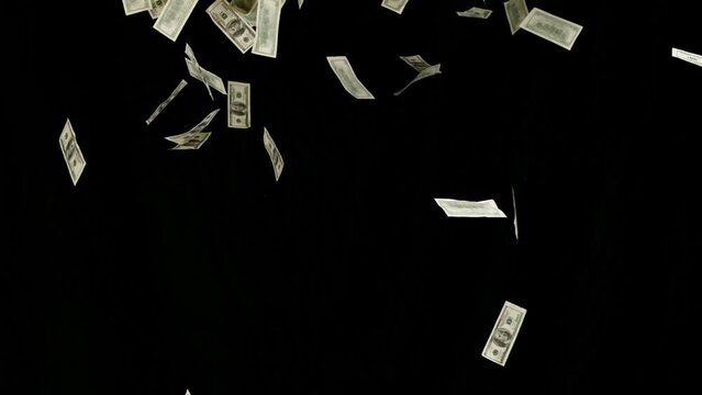 Super slow motion of flying US dollars banknotes on black background. Filmed on high speed cinema camera, 1000fps.