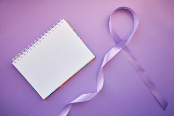 Mockup of notepad and purple ribbon for Purple Day - World Epilepsy Day, March of 26. Symbol of...