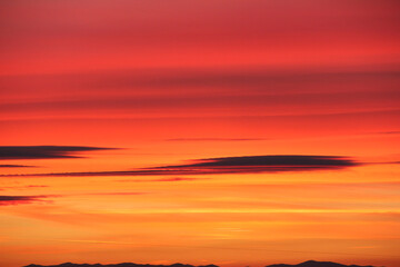 Fototapeta premium Sunset. Sky with clouds. With shades of pink and yellow.