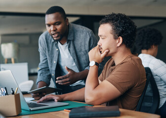 Im just going to give you some feedback on that. Shot of two young businessmen working together in...