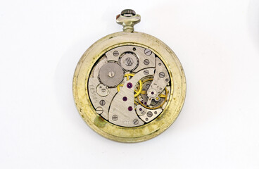 Pocket watch mechanism isolated on white background