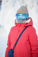 Fototapeta na wymiar Cute girl hiking in snowshoes