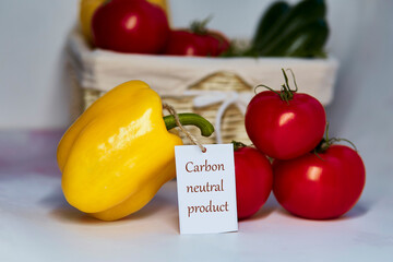 Carbon neutral product label on tomatoes and yellow bell pepper. Carbon labeling. Net zero carbon,...