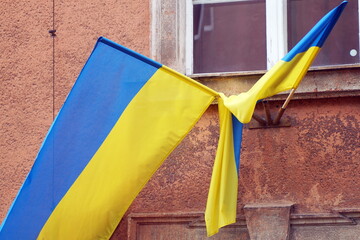 On the facade of the building there are flags of Ukraine as a sign of solidarity with the people...