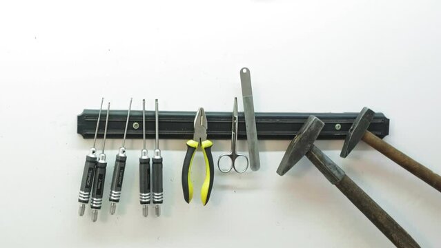 Screwdrivers, pliers and other tools in the knife grinder workshop