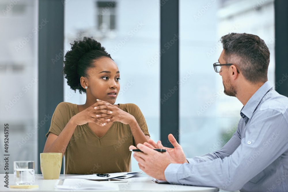 Poster Implementing the most effective strategies for their business. Cropped shot of two colleagues having a meeting in an office.