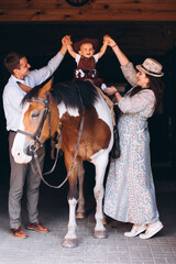 Fototapeta na wymiar Family with little son at ranch