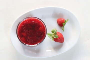 Strawberry sauce. Prepared from fresh strawberries boiled and reduced to a sauce consistency added with sugar