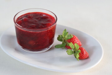 Strawberry sauce. Prepared from fresh strawberries boiled and reduced to a sauce consistency added...