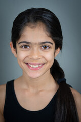 A school age Indian ethnicity girl - portrait shots with different facial expressions. 