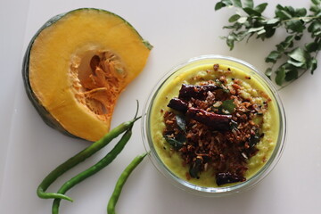 Coconut based pumpkin curry. A pumpkin side dish to go with rice, part of kerala meals. Commonly...