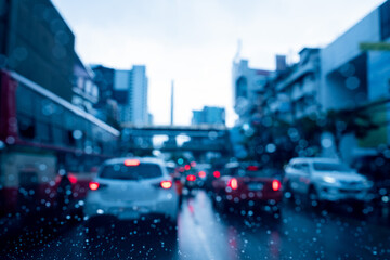 Droplet of water on car mirror, traffic jam