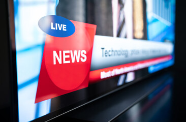 Tv news live broadcast and production concept. Breaking newscast on television. Screen close up of...