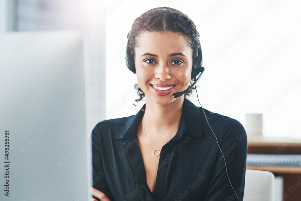 Poster we put quality into every call. portrait of a young call centre agent working in an office.