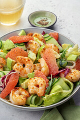 Healthy salad with shrimp prawns, grapefruit, avocado, cucumber and green salad