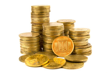 Golden coins isolated on white. Ukrainian coins with the coat of arms of Ukraine, trident is symbol...