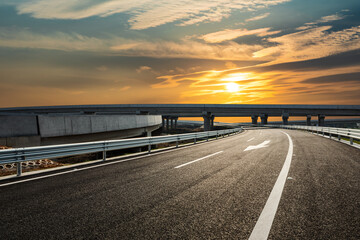 Fototapeta premium Asphalt highway and beautiful sky cloud landscape at sunset. Road and sky cloud background.