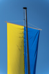 Ukrainian flag on the background of the blue sky