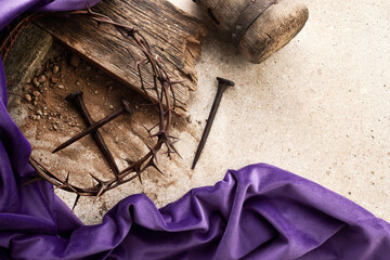 Crucifixion Of Jesus Christ. Cross With three Nails And Crown Of Thorns on ground