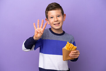 Little boy holding fried chips isolated on purple background happy and counting four with fingers