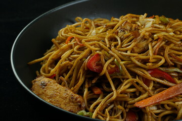 Spaghetti, pasta with tomato sauce and cherry tomatoes with basil on a dark background. Selective focus, copy space. shrimp spaghetti. 