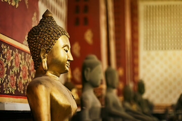 buddha statue in church and in a temple in Thailand There is light from the lamp
