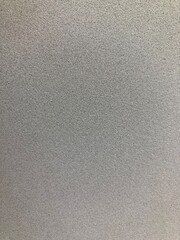 light gray porous surface with empty space for text