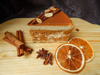 cake with spices on wooden background