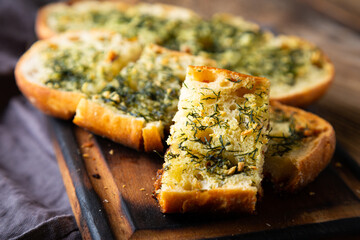 Crispy bread with garlic butter and dill - Powered by Adobe