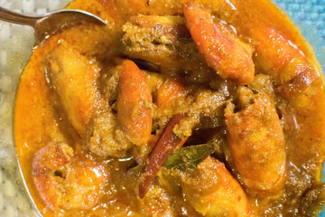 Orange coloured Prawns, cooked and served in a bowl, Indian delicacy food - called 