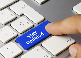 Stay Updated - Inscription on Blue Keyboard Key.