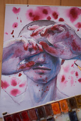 The photo shows a drawing. A man closes his eyes with his hands on the hands of the blood around the blood stain. War.