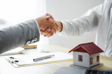 Business meeting Handshake. home loan insurance. .Real estate broker and client  sign contract...