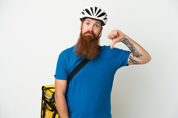 Young reddish caucasian man with thermal backpack isolate don white background showing thumb down...
