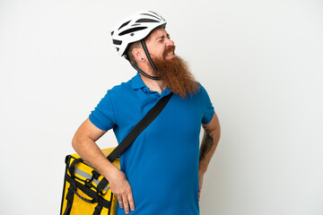 Young reddish caucasian man with thermal backpack isolate don white background suffering from backache for having made an effort